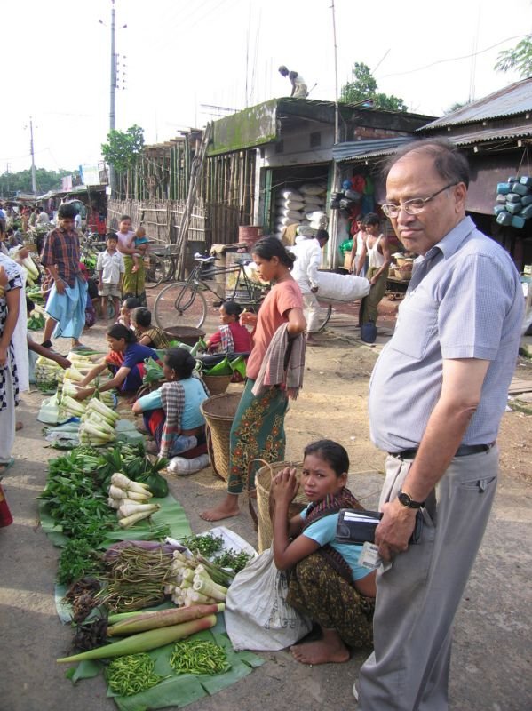 Abbu buying bamboo shoots in the market

