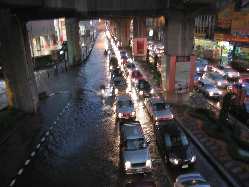 it was the monsoon season. this is looking down in siam square from a pedestrian bridge to the streets, everything is flooded after a day of rain
