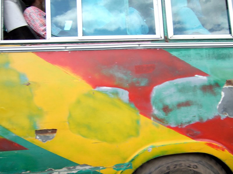 bus passsing by us on the highway. they drive psychotically, you can see how beat up they get. rule of the road: if you are in a smaller vehicle, you move out of their way.
