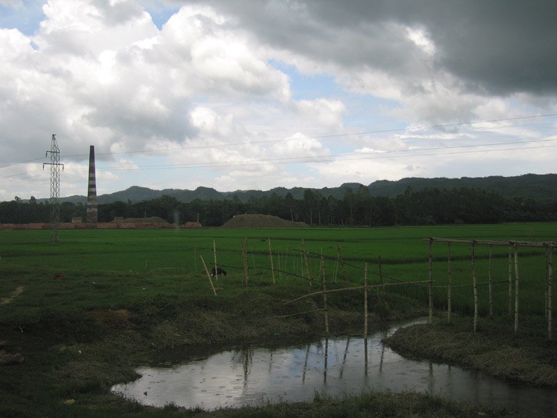 brick factory in between the rice fields and the hills.  the reddish stuff is all bricks
