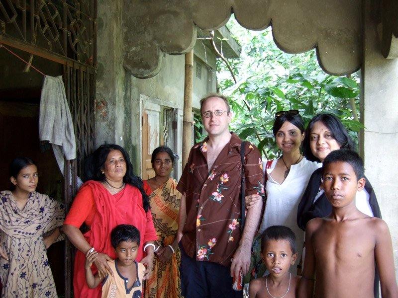 Chuck, me and Ammu (my mom) with the family that takes care of the temple
