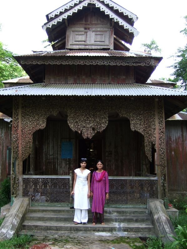 Anika and Ammu in front of temple. the 3 wooden buildings of the temple complex have a number of precious Buddhist relics
