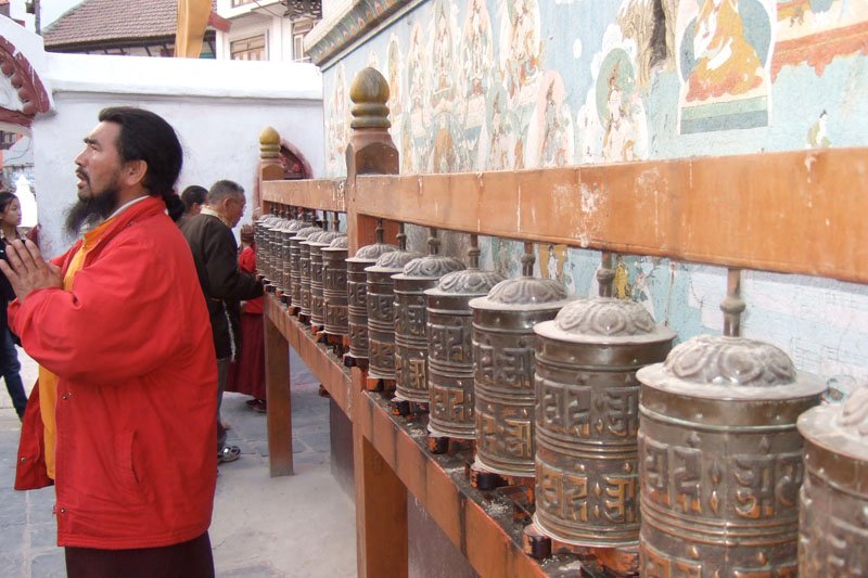 the prayer wheels all around the stupa
