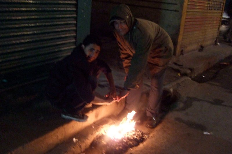 it was very cold at night (30 F), and most people don't have heating in their homes. we'd see people warming themselves by little streetside fires 
