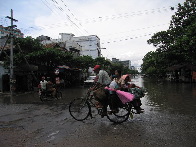 many of the streets of mandalay would get flooded whenever it would rain and sometimes the only way to go across a street without wading knee-deep in water was to take a rickshaw for that short distance
