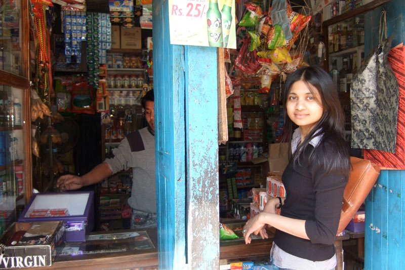 Shahrina (my sister) buying some snacks at a roadside stall
