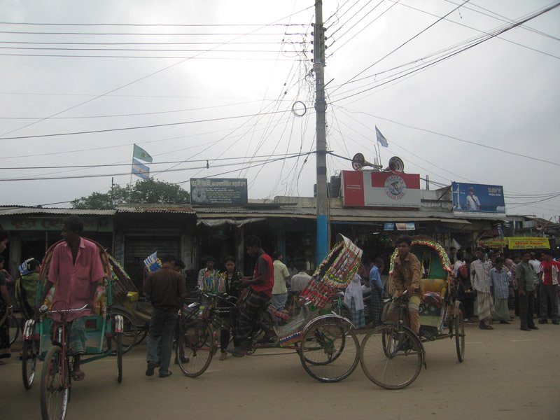 rickshaws in the bustling small town market
