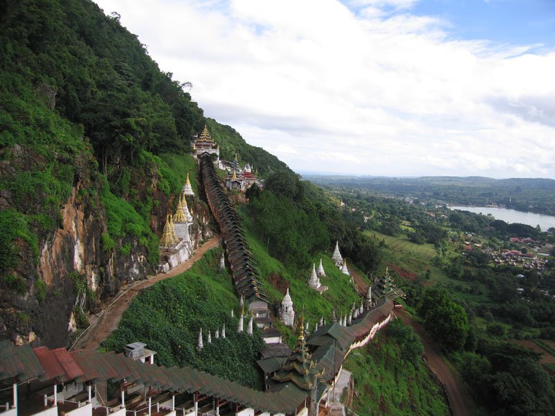 the many little pagodas perched along the steep sides and the entrance winding up the side
