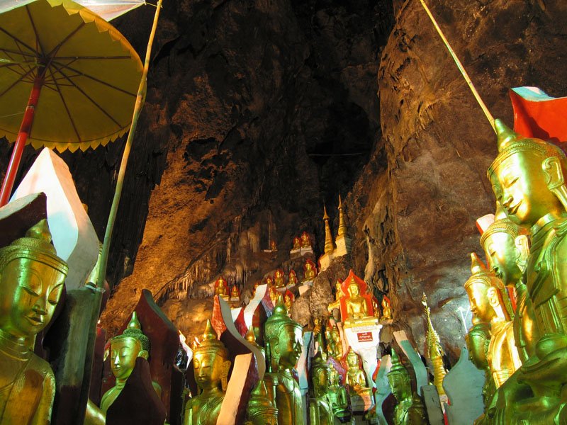 some of the 9000 buddha statues inside the cave. some have been there since the 11th century.  unfortunately, recently it was decided to paint these statues in gold and red, which destroyed their beauty
