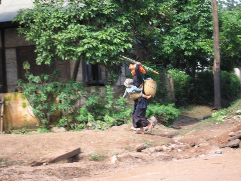 walking around hilly terrain with baby strapped in front, big basket of goods in the back and an umbrella in your free hand.  in the US you'd probably be reported to child welfare agencies for "endangering" your baby like this
