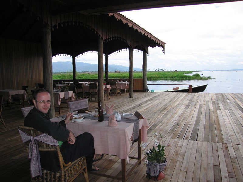  it was amazingly relaxing sitting at this restaurant surrounded by water and mountains, watching the occasional fisherman or lake people going by on their canoe
