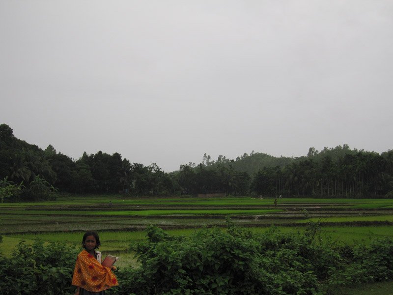 village kid on her way to school
