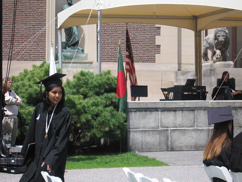 Zaynah walking away from the stage with her diploma
