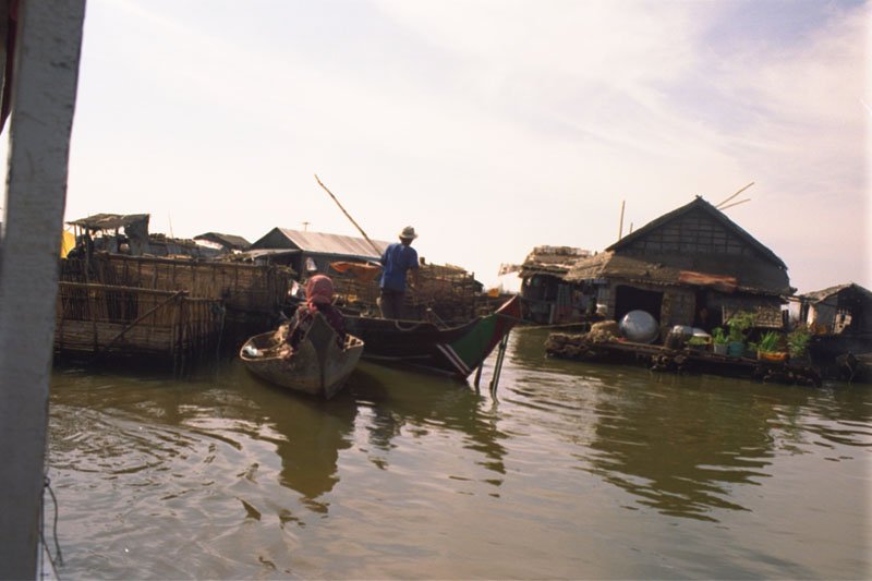 commerce on the lake.  people go on these canoes from one floating house to another selling all kinds of stuff
