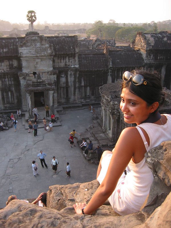 sitting at the top of the steps of the center tower at Angkor Wat. i finally managed a smile for Chuck after my petrifying experience climbing the almost vertical wall of super narrow & super steep steps
